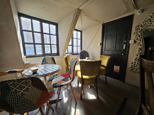 Coffee Aroma attic seating area in the sunshine.